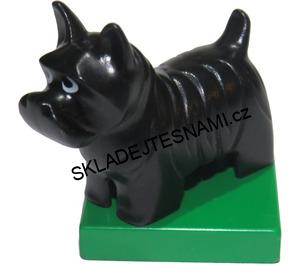 H556 DUPLO HRANÝ ČERNÝ PES NA ZELENÉM PODSTAVCI